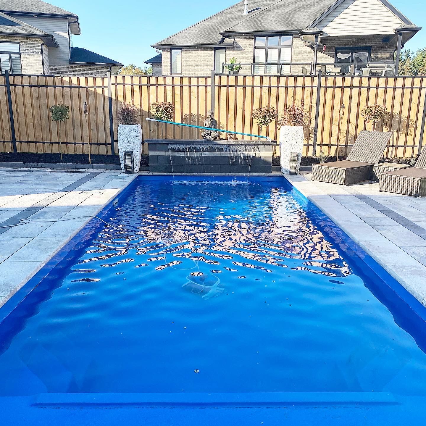 Rectangular pool with twin sheer-descent water features